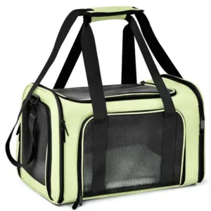 A light lime green pet carrier bag with black accents, featuring mesh ventilation windows, multiple black straps, and zippers, designed for pet transportation, set against a white background.